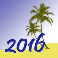 Palm trees on a beach with the year 2016 in large type in front of them