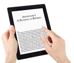 Hands holding a large black-and-white tablet on which text is displayed